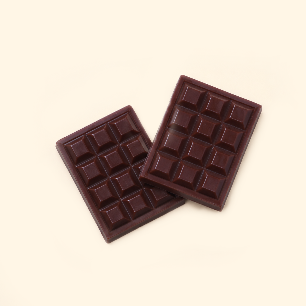 Classic Chocolate Bar Wax Melts with two dark brown chocolate-bar-shaped wax melts overlapping on a light cream background.