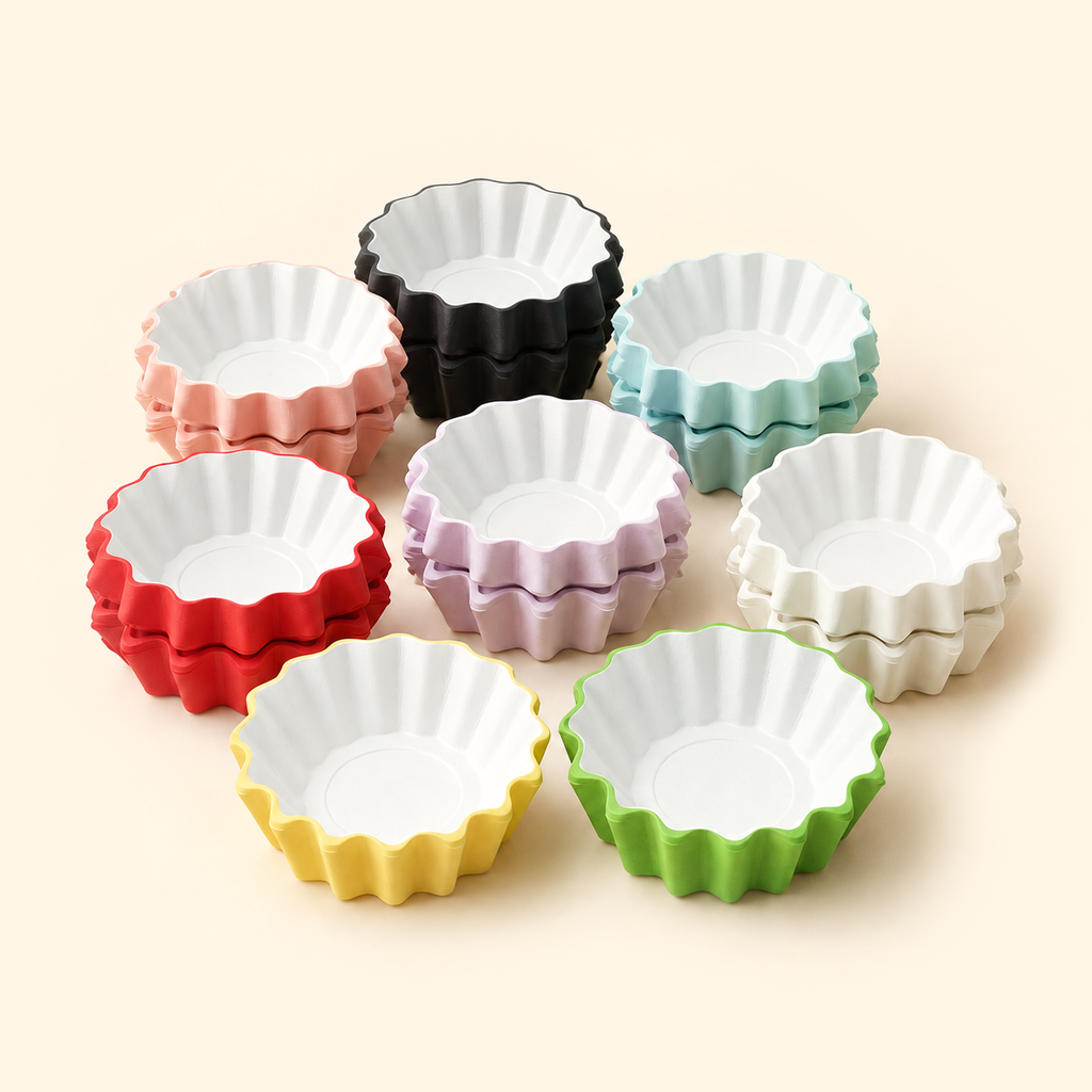 Assorted disposable wax melt liners in eight colors, stacked with white interiors on a warm ivory background