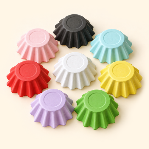 Eight assorted-color disposable wax melt liners shown upside down with fluted exteriors and circular bases