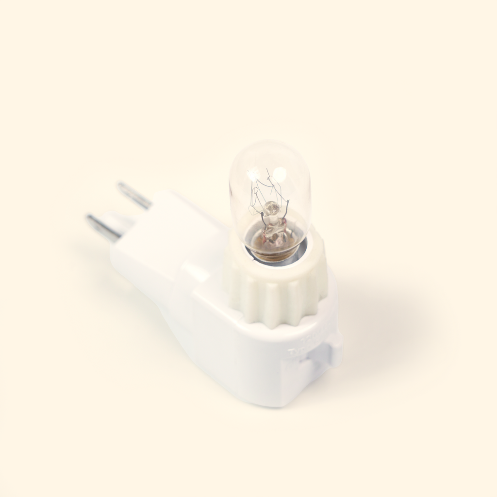 White plug base and bulb for the Pluggable Wax Warmer.