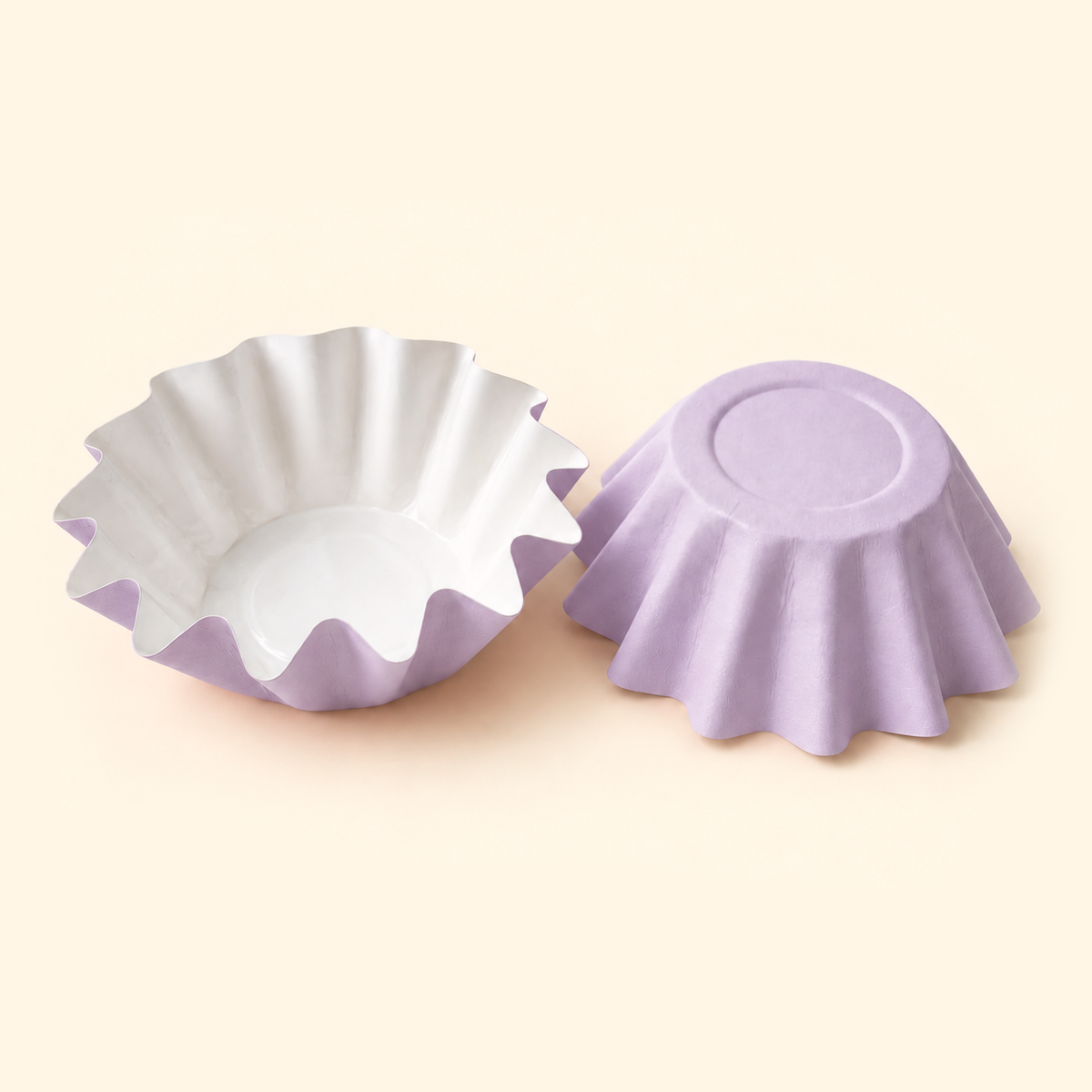 Lavender disposable wax melt liners with white interiors, shown open and upside down on a warm ivory background