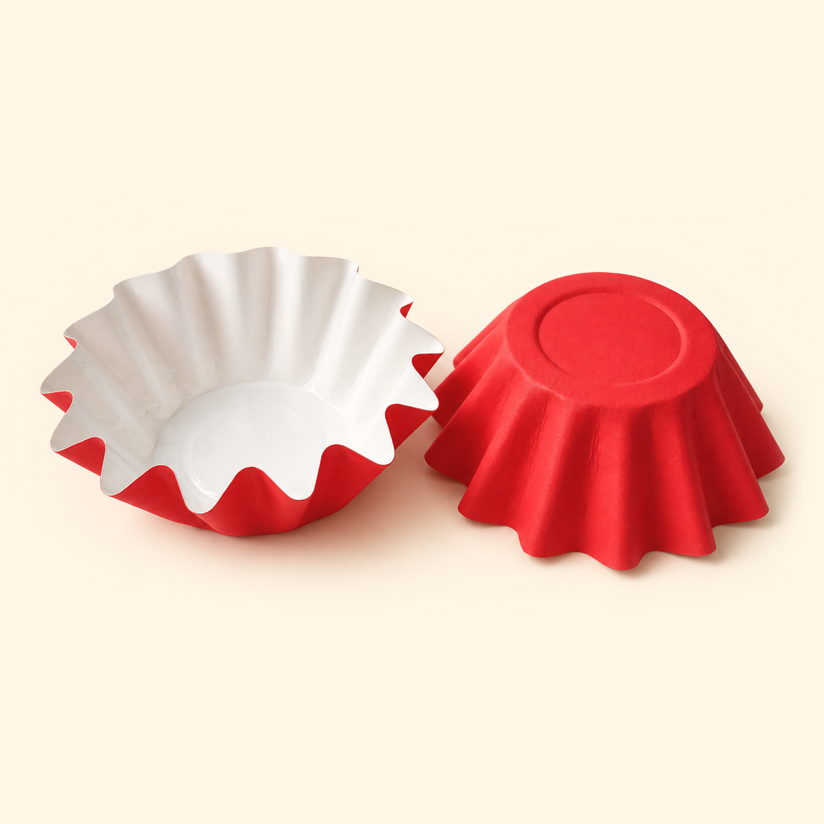 Red disposable wax melt liners with white interiors, shown open and upside down on a warm ivory background