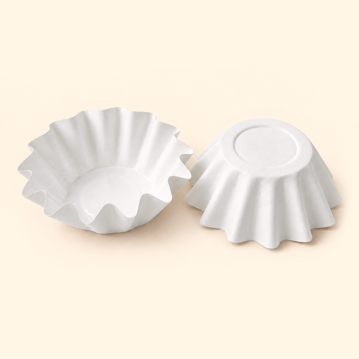 White disposable wax melt liners shown open and upside down on a warm ivory background