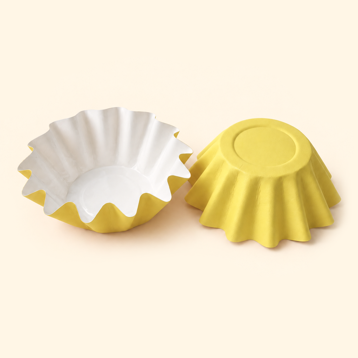 Yellow disposable wax melt liners with white interiors, shown open and upside down on a warm ivory background